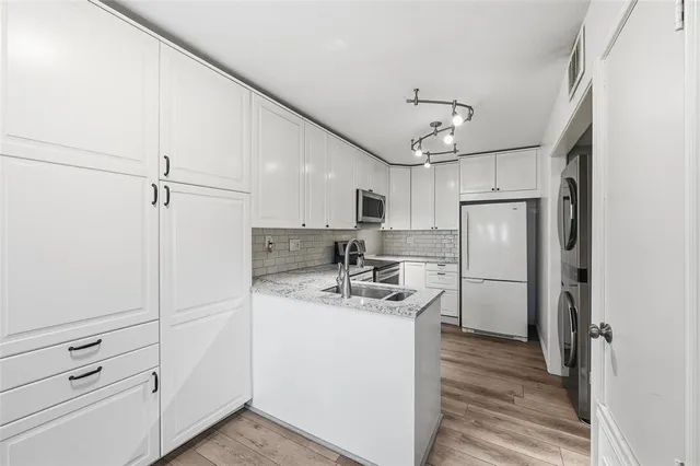 a kitchen with refrigerator cabinets and counter top space