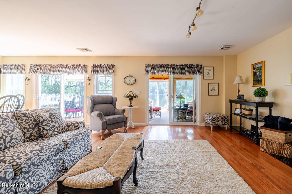 16 Heberts Cove Monterey, MA 01230 - Photo 11 of 47 a living room with furniture and a large window