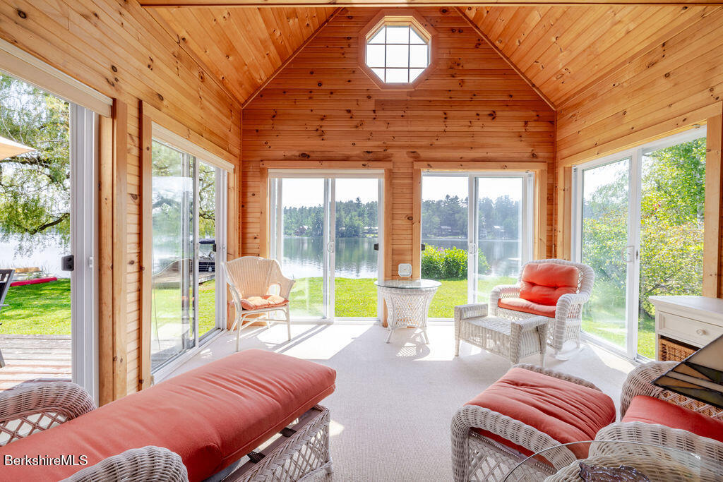 16 Heberts Cove Monterey, MA 01230 - Photo 12 of 47 a bedroom with furniture and large windows