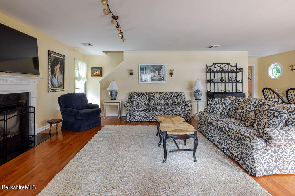 16 Heberts Cove Monterey, MA 01230 - Photo 13 of 47 a living room with furniture and a fireplace