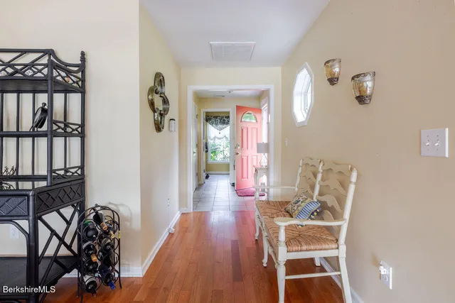a view of a livingroom with furniture and hardwood floor