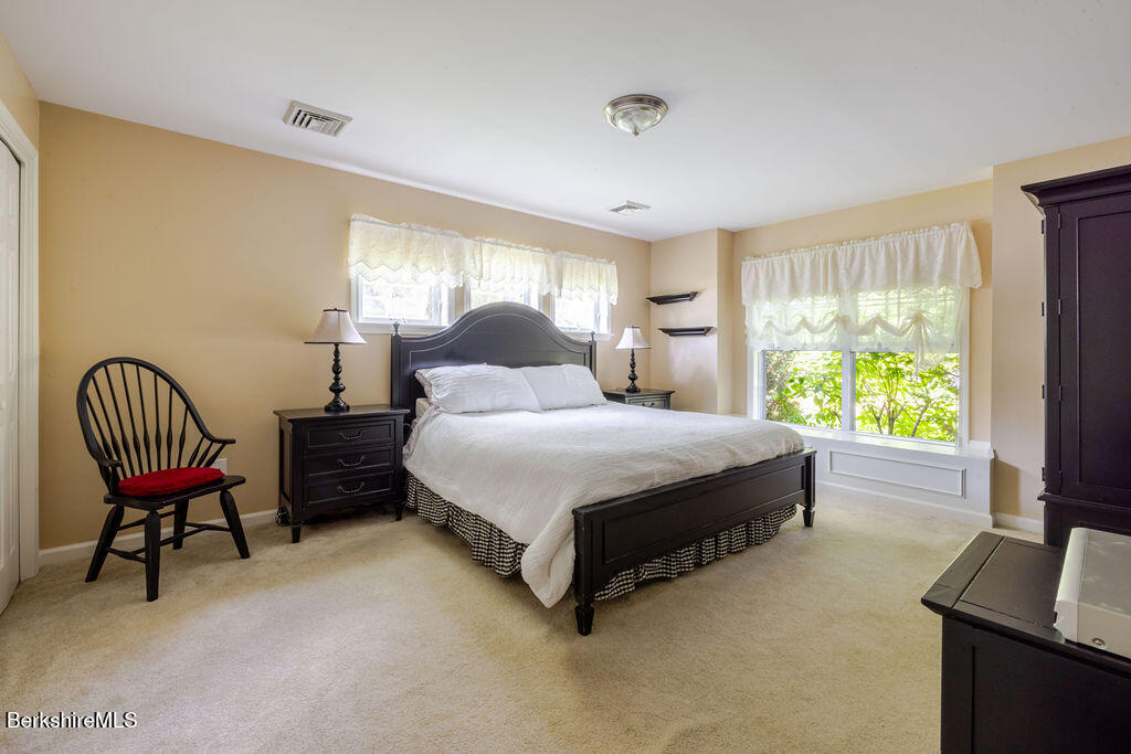 16 Heberts Cove Monterey, MA 01230 - Photo 25 of 47 a bedroom with a bed chair and window