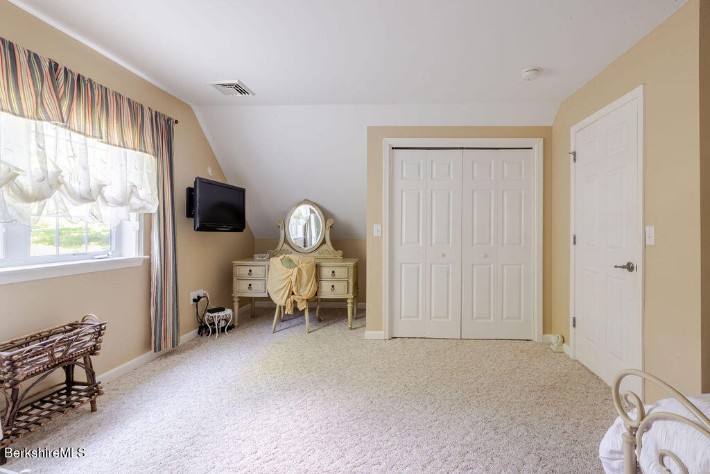 16 Heberts Cove Monterey, MA 01230 - Photo 29 of 47 a living room with furniture a flat screen tv and a window