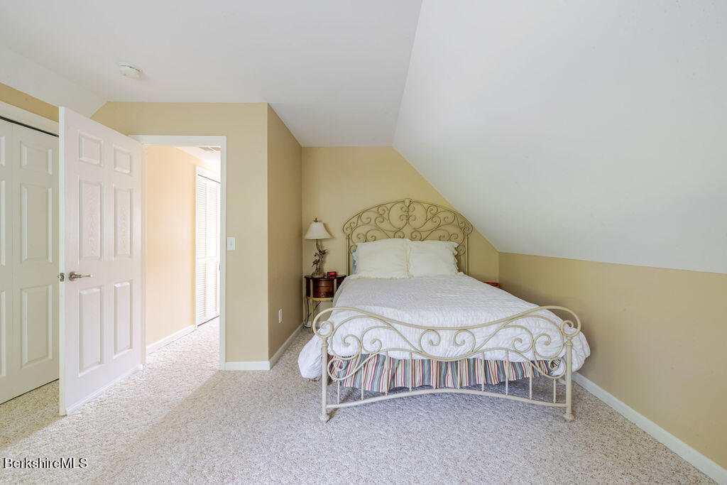 16 Heberts Cove Monterey, MA 01230 - Photo 30 of 47 a bedroom with a bed and a window