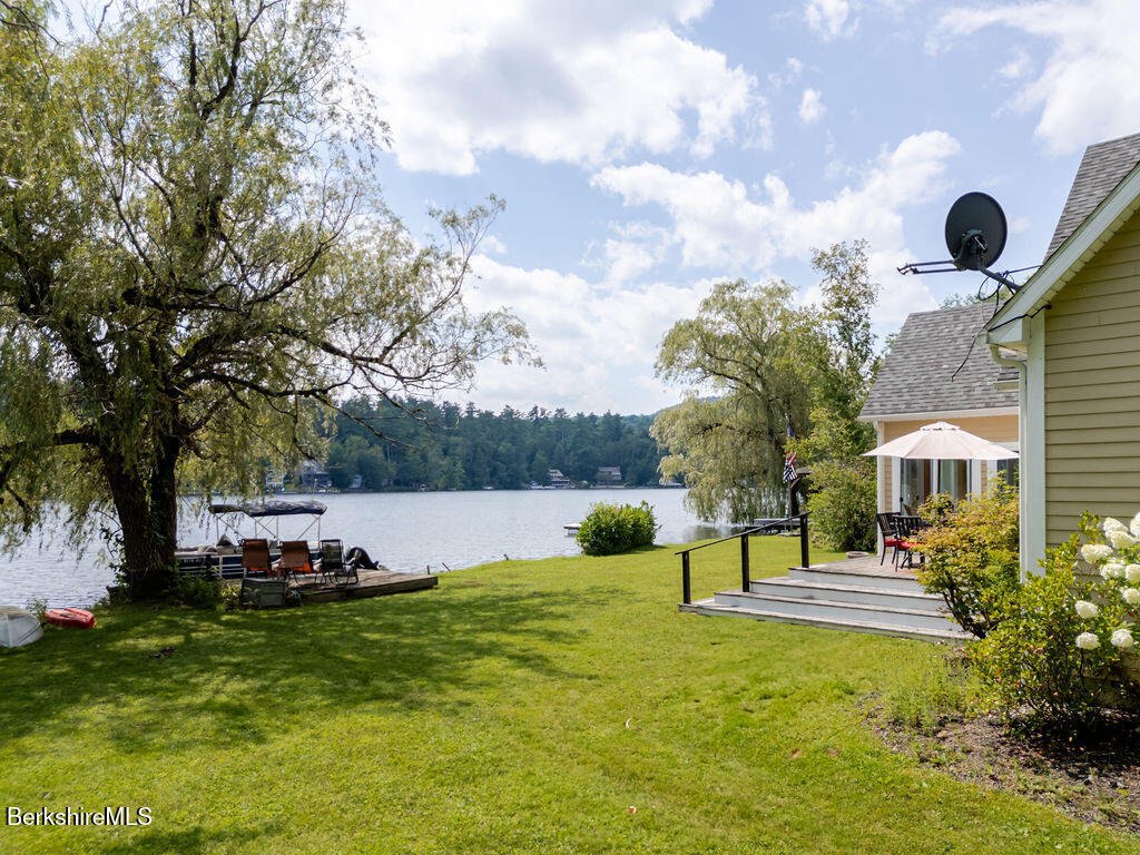 16 Heberts Cove Monterey, MA 01230 - Photo 3 of 47 a swimming pool with lots of tress in front of it