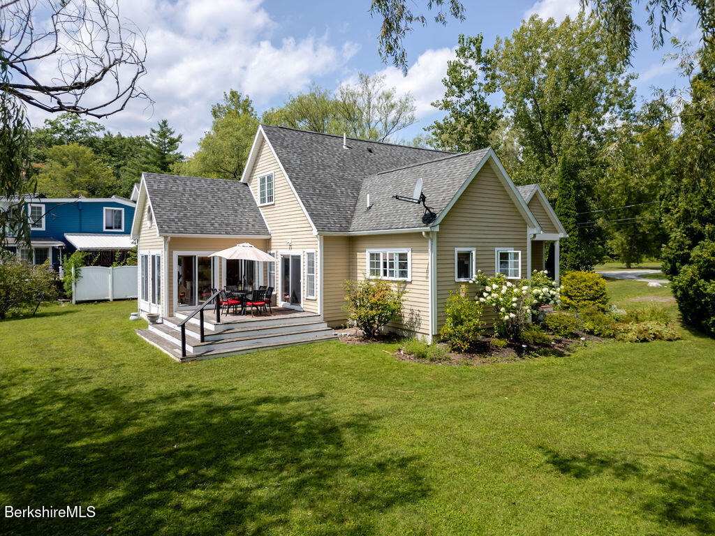 16 Heberts Cove Monterey, MA 01230 - Photo 36 of 47 a view of house with garden and trees