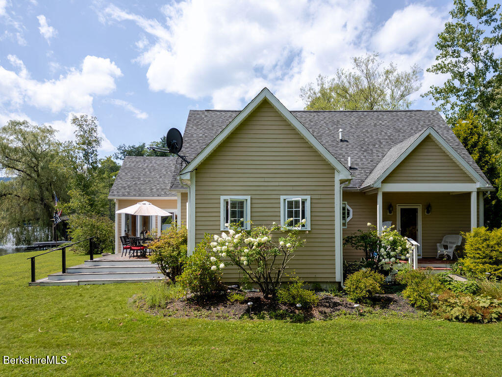 16 Heberts Cove Monterey, MA 01230 - Photo 37 of 47 a front view of house with yard and green space