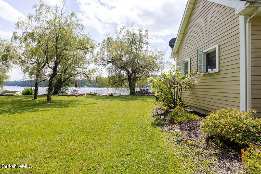 16 Heberts Cove Monterey, MA 01230 - Photo 38 of 47 a view of swimming pool with outdoor seating and garden