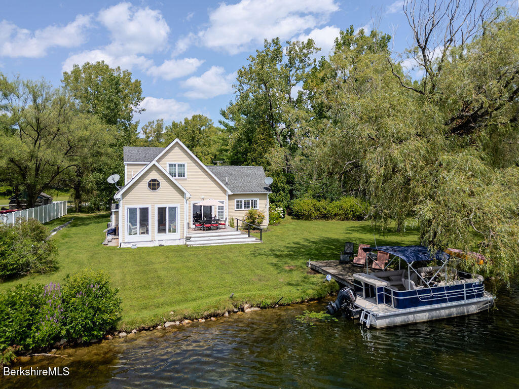 16 Heberts Cove Monterey, MA 01230 - Photo 42 of 47 a view of a house with a yard deck and sitting area