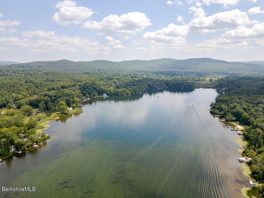 16 Heberts Cove Monterey, MA 01230 - Photo 46 of 47 a view of a lake with houses in back