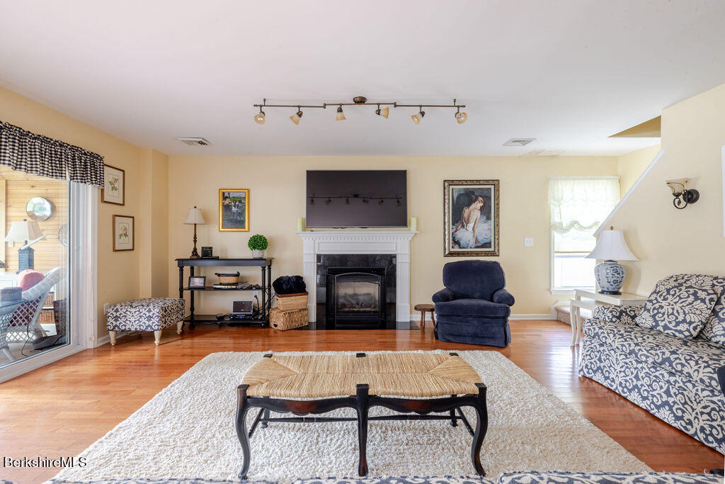16 Heberts Cove Monterey, MA 01230 - Photo 9 of 47 a living room with furniture and a fireplace