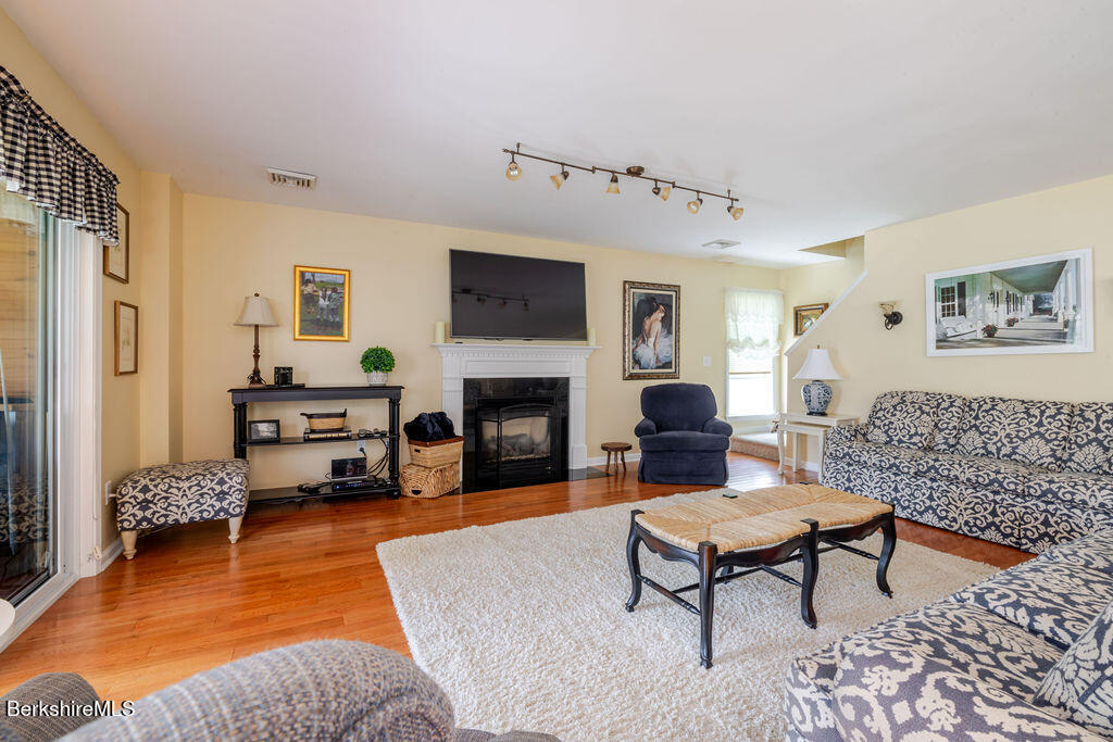 16 Heberts Cove Monterey, MA 01230 - Photo 10 of 47 a living room with furniture and a fireplace