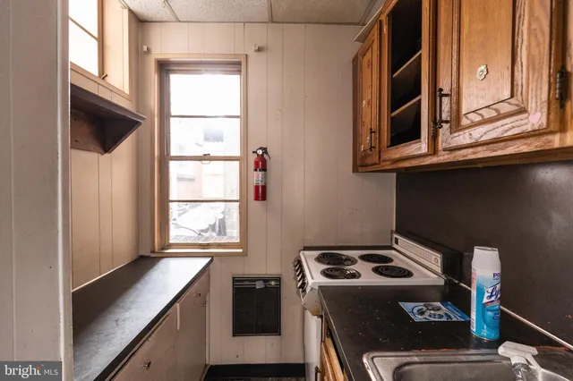 a kitchen with a stove and a microwave