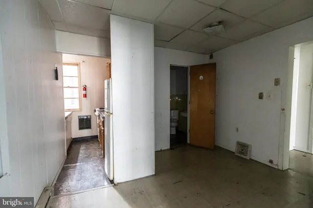 a kitchen with stainless steel appliances granite countertop a refrigerator and a stove