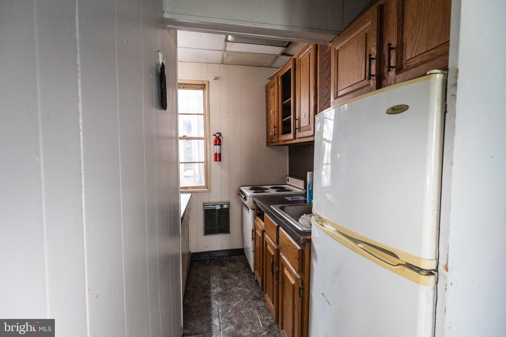 212 West Market Street, Unit A Pottsville, PA 17901 - Photo 10 of 10 a kitchen with stainless steel appliances granite countertop a refrigerator and a stove
