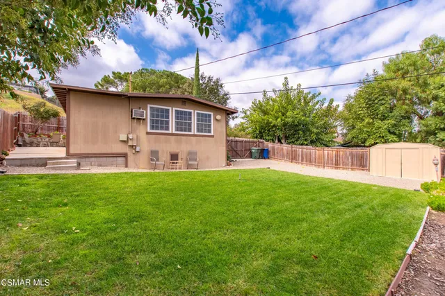 a view of backyard with green space