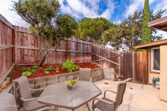a backyard of a house with seating space