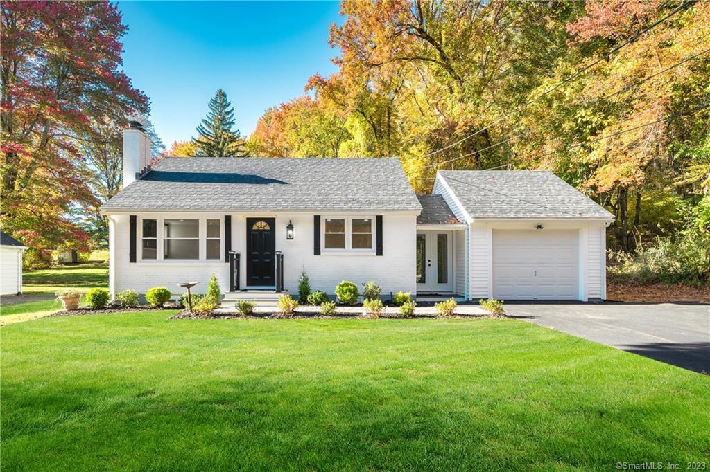 23 Penny Corner Road Portland, CT 06480 - Photo 1 of 1 a front view of a house with a garden and trees
