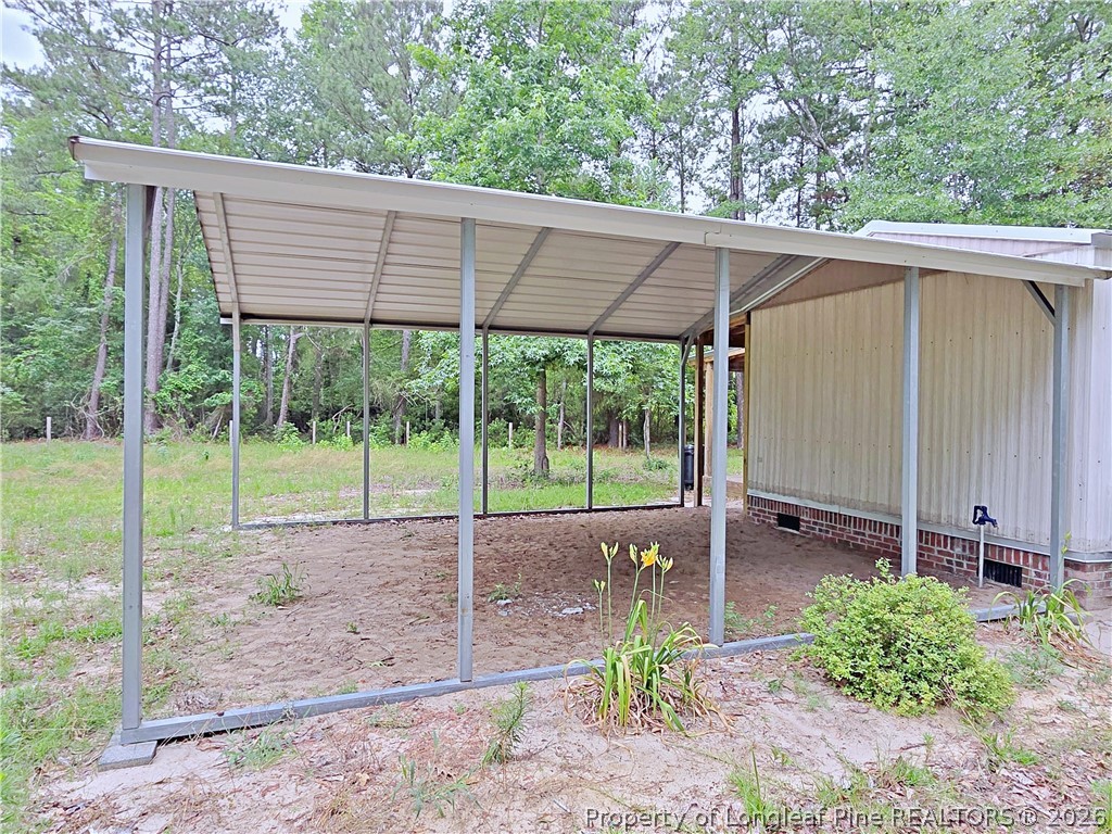 1031 Pine Acres Road White Oak, NC 28399 - Photo 22 of 29 a view of a house with backyard and porch