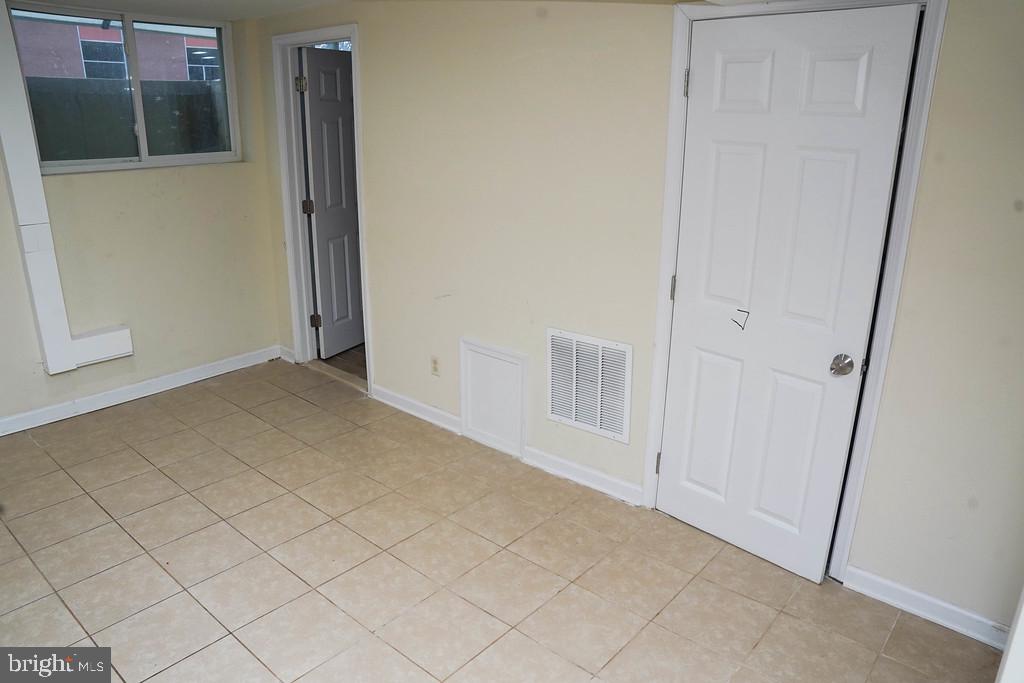 3814 Erdman Avenue Baltimore, MD 21213 - Photo 14 of 18 an empty room with windows
