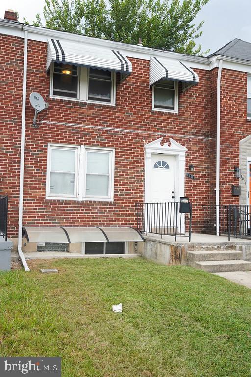 3814 Erdman Avenue Baltimore, MD 21213 - Photo 2 of 18 a front view of a house with a garden