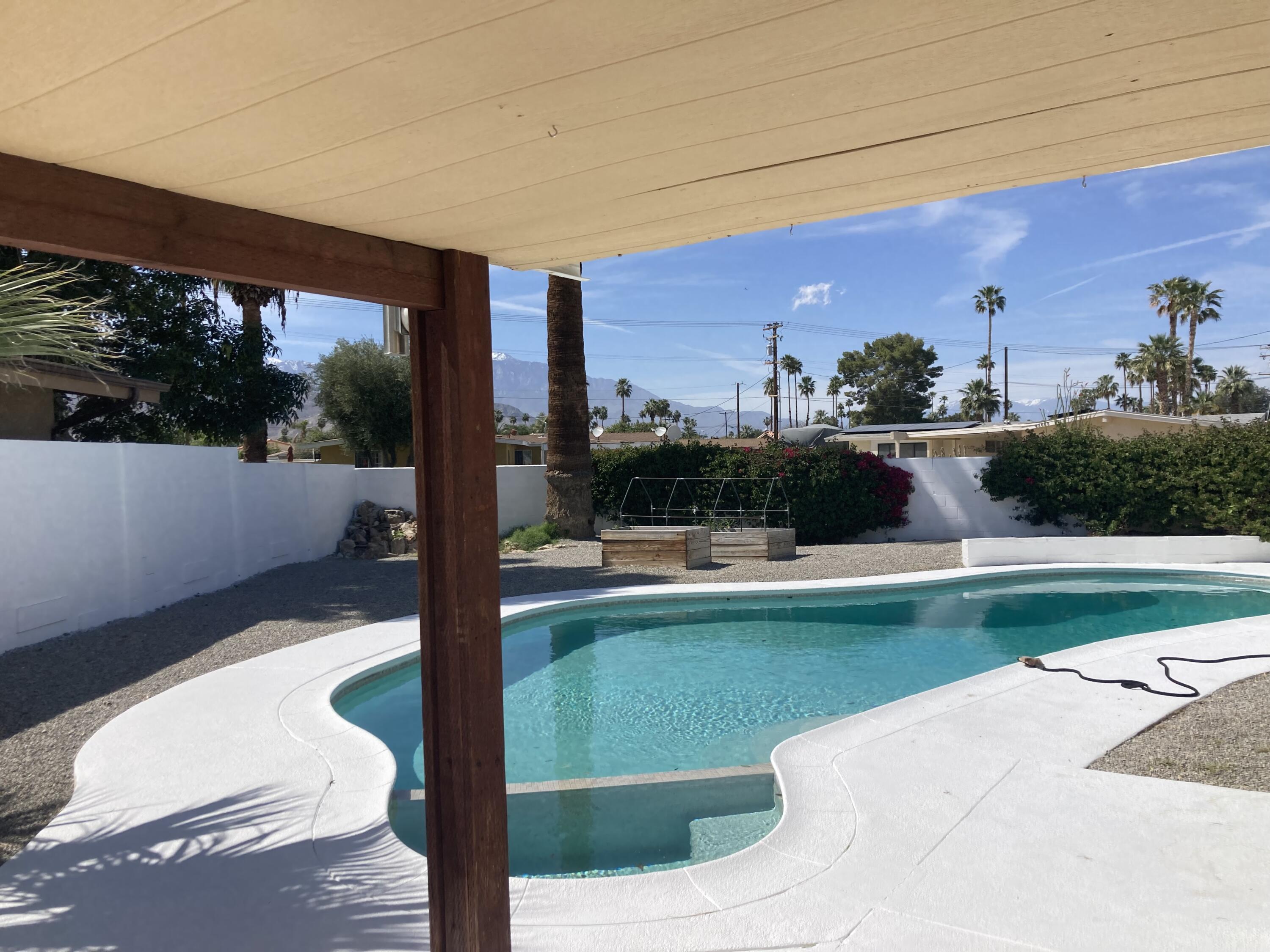 74091 Aster Drive Palm Desert, CA 92260 - Photo 2 of 16 a view of swimming pool from a balcony