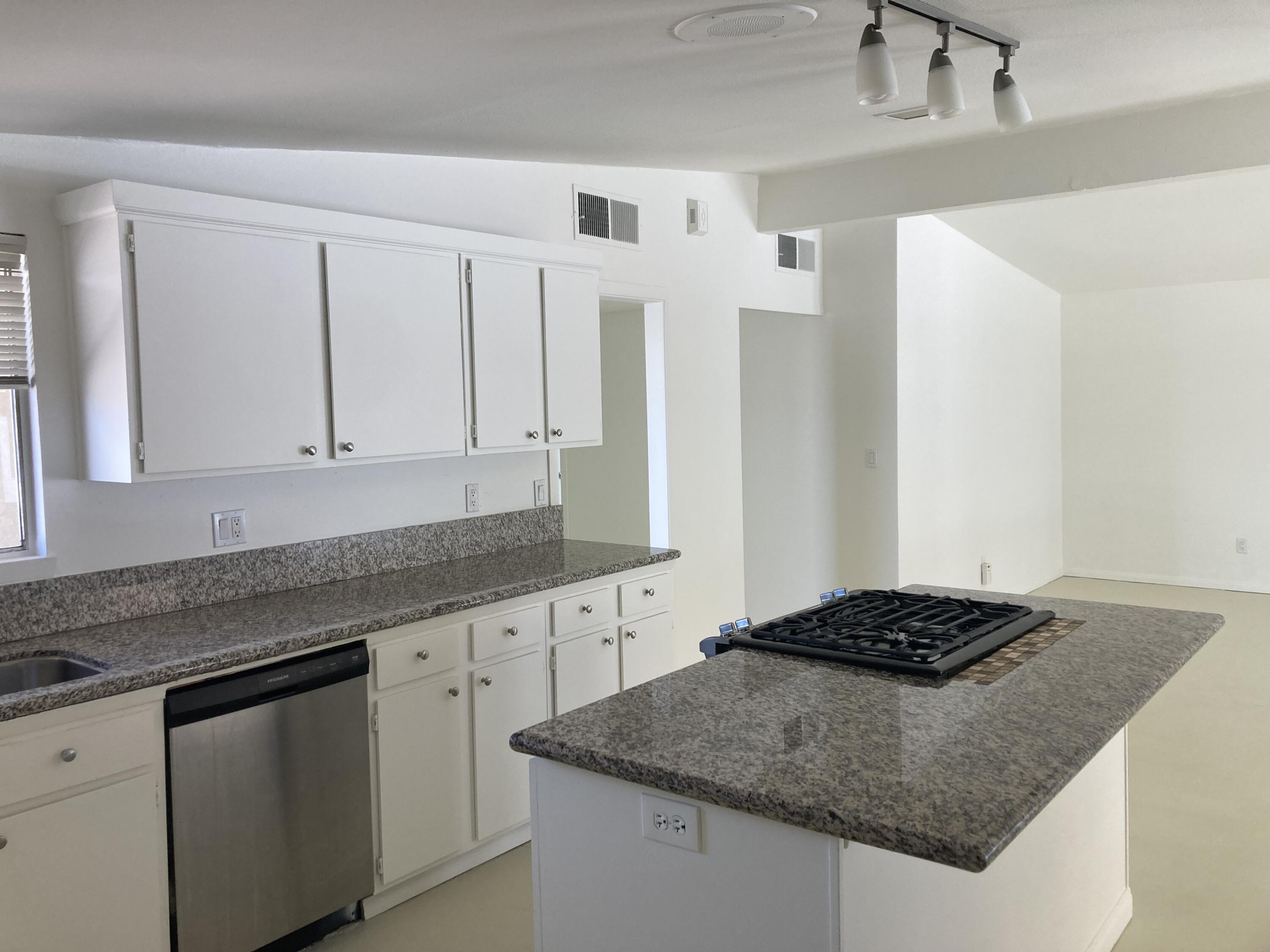 74091 Aster Drive Palm Desert, CA 92260 - Photo 5 of 16 a kitchen with stainless steel appliances granite countertop a sink stove and cabinets