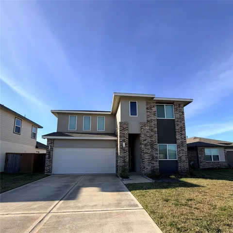 a front view of a house with yard