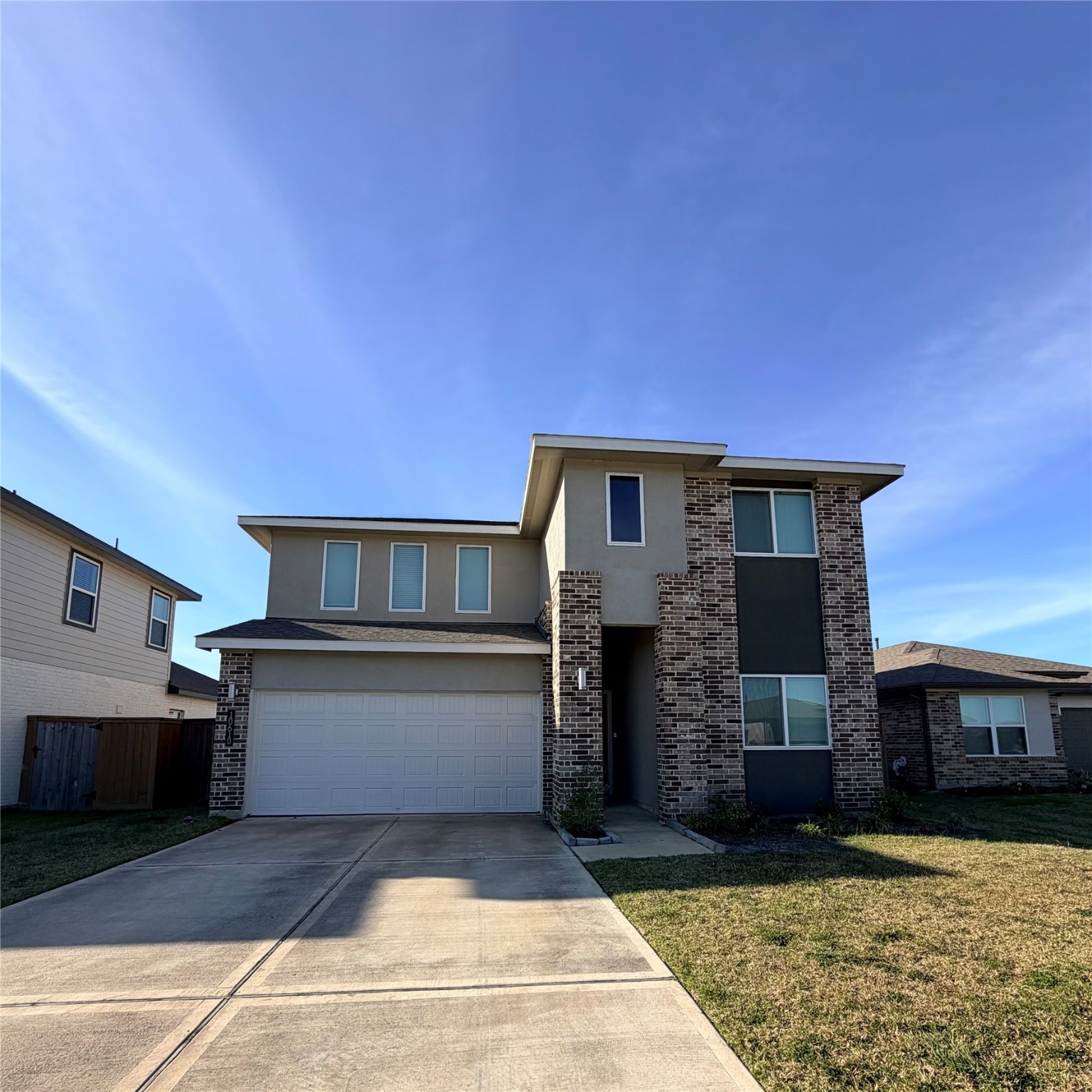 a front view of a house with yard