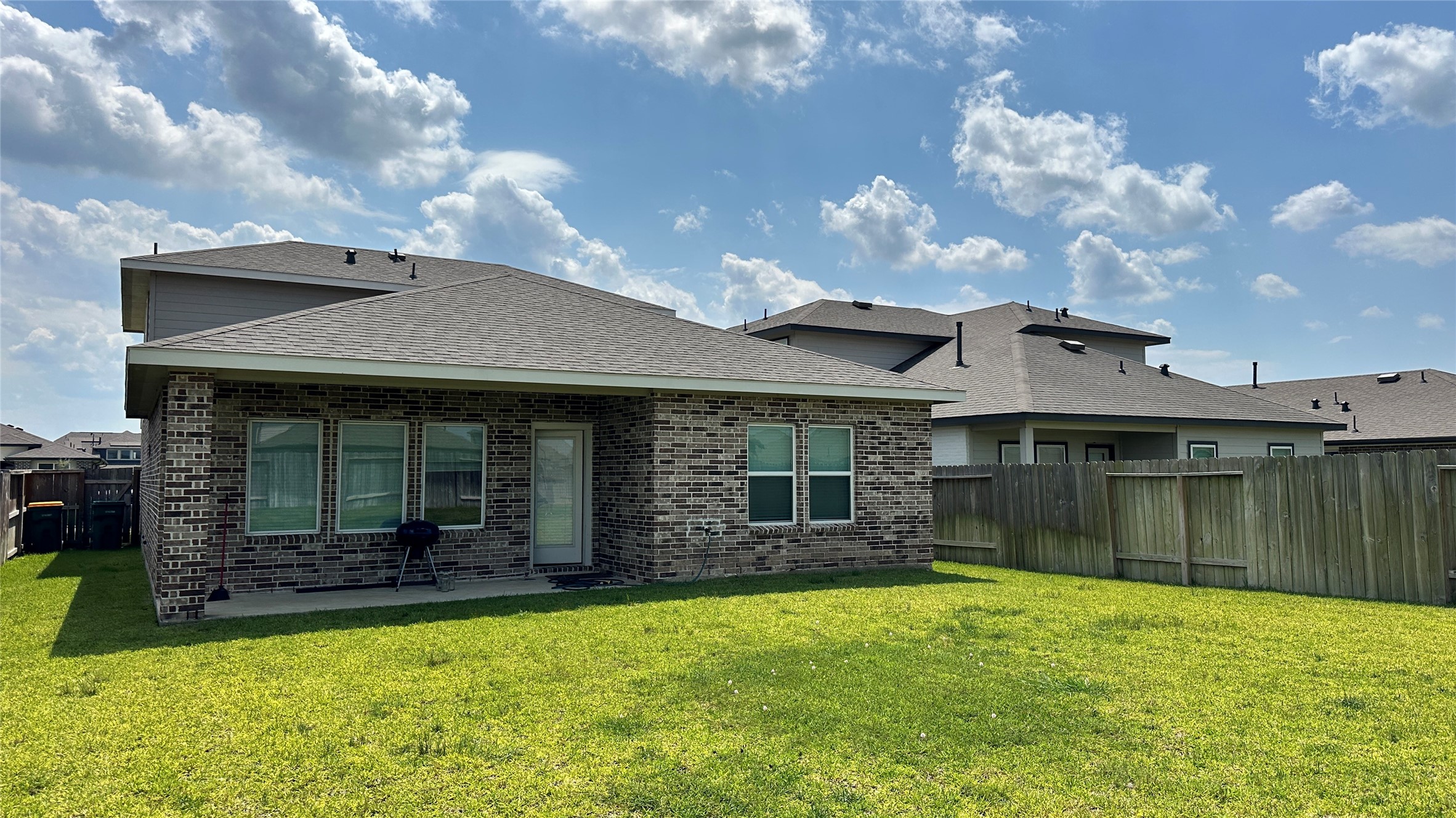 10610 Great Basin Drive Rosharon, TX 77583 - Photo 14 of 14 a view of a house with a backyard and porch