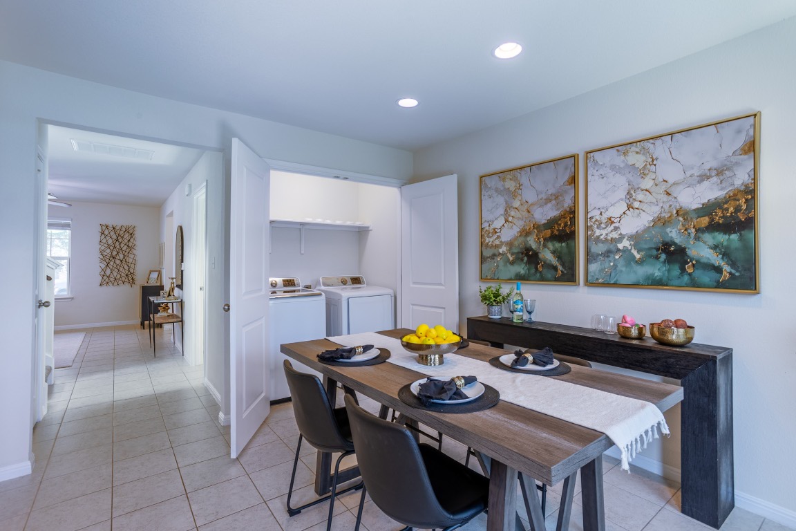 17927 Papaveri Way Pflugerville, TX 78660 - Photo 15 of 26 a view of a dining room with furniture and a potted plant