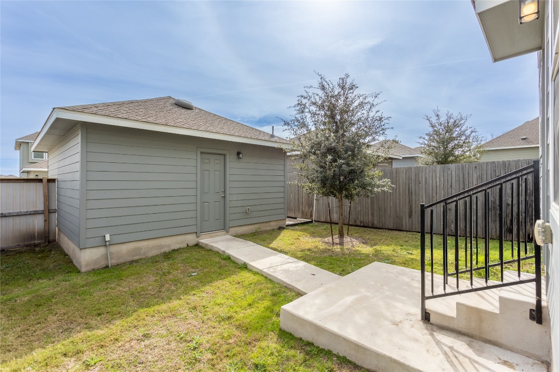 17927 Papaveri Way Pflugerville, TX 78660 - Photo 24 of 26 a view of a backyard with a iron fence