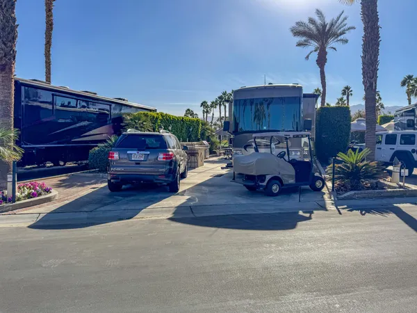a view of living room filled with furniture and a chandelier