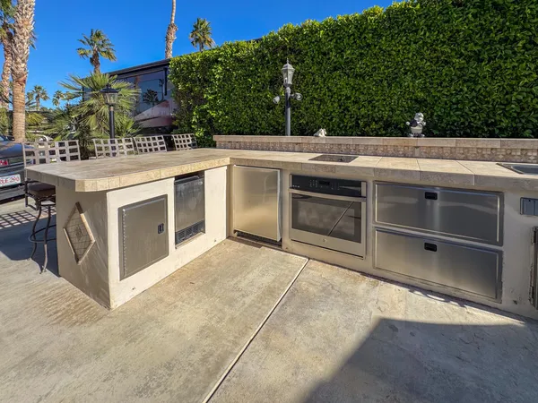 a view of a kitchen with a stove and cabinets