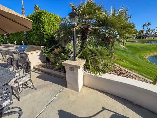 a view of a yard and a patio