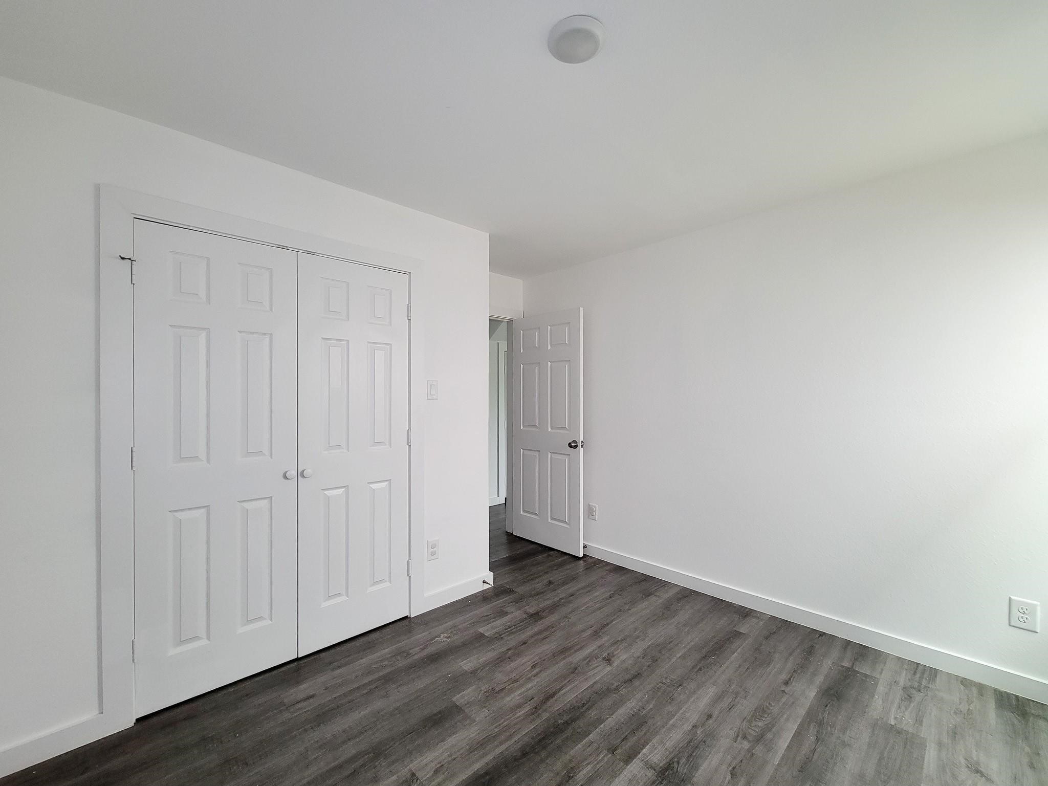 8122 Sterlingshire Street, Unit B Houston, TX 77078 - Photo 15 of 27 a view of an empty room and wooden floor
