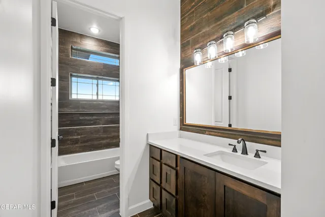 a view of an empty room with a fireplace