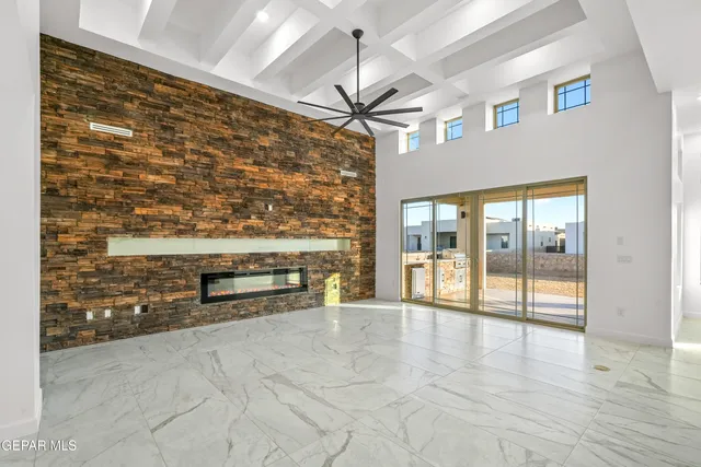 a large kitchen with a stove and refrigerator