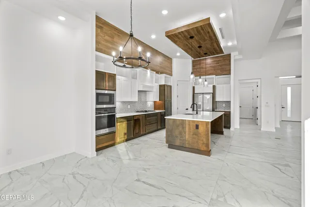 a spacious bathroom with a shower and a sink