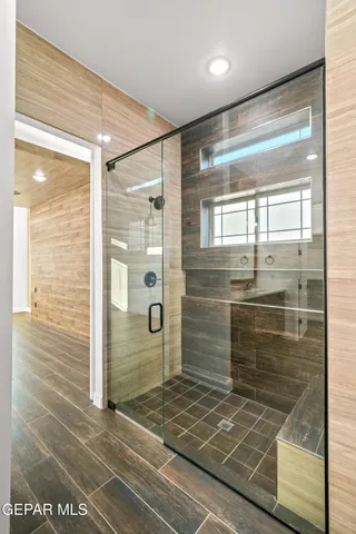 a bathroom with a toilet and a bathtub