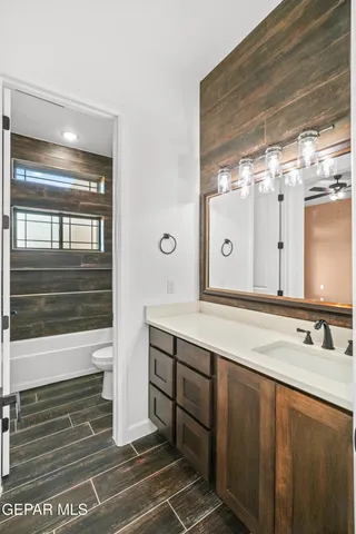 a view of a big house with a big yard and large tree