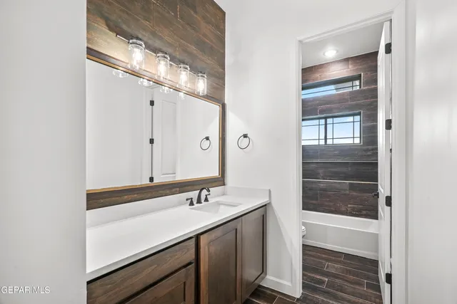 an aerial view of residential building with an outdoor space and seating