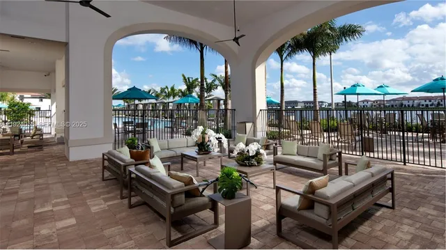 a swimming pool with outdoor seating and yard