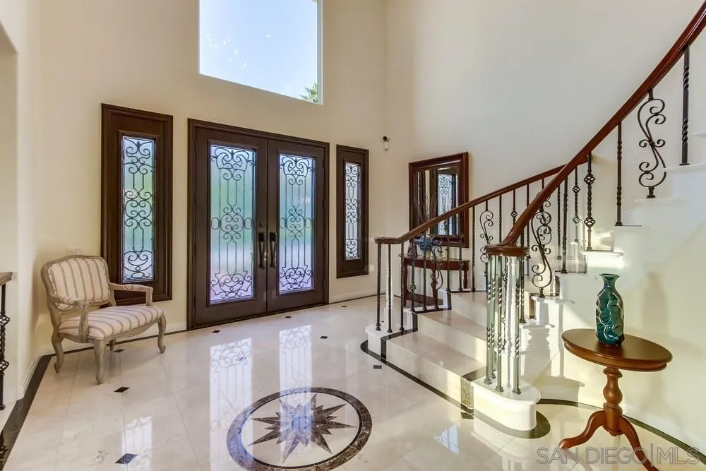 17843 Valle Verde Road Poway, CA 92064 - Photo 17 of 70 a living room with furniture and a floor to ceiling window