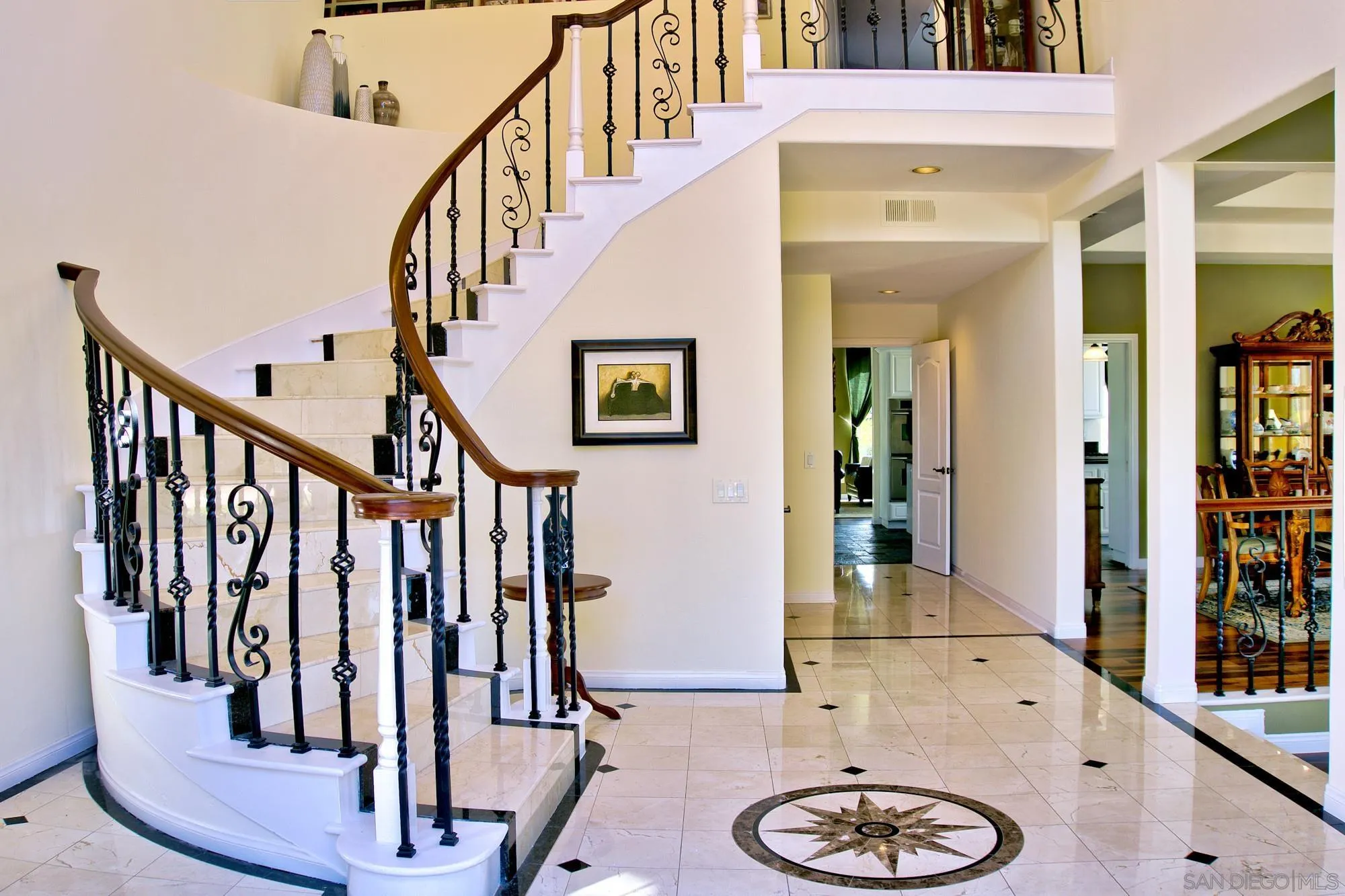 17843 Valle Verde Road Poway, CA 92064 - Photo 18 of 70 a view of a hallway with wooden floor and stairs