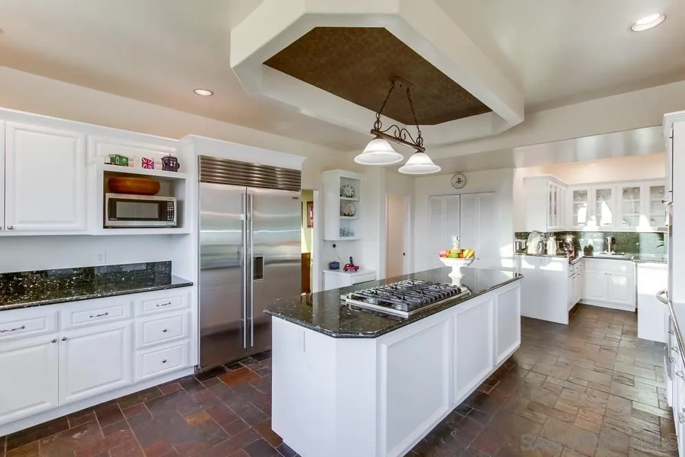 17843 Valle Verde Road Poway, CA 92064 - Photo 21 of 70 a kitchen with stainless steel appliances kitchen island granite countertop a sink and cabinets