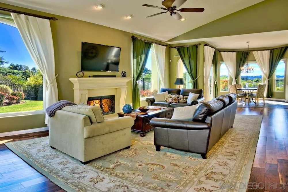 17843 Valle Verde Road Poway, CA 92064 - Photo 25 of 70 a living room with fireplace furniture and a large window