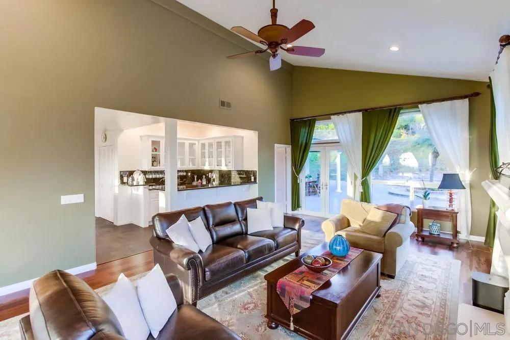 17843 Valle Verde Road Poway, CA 92064 - Photo 27 of 70 a living room with furniture and a large window