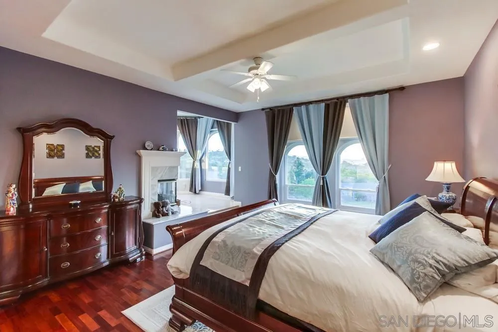 17843 Valle Verde Road Poway, CA 92064 - Photo 36 of 70 a bedroom with a bed dresser and a flat tv screen