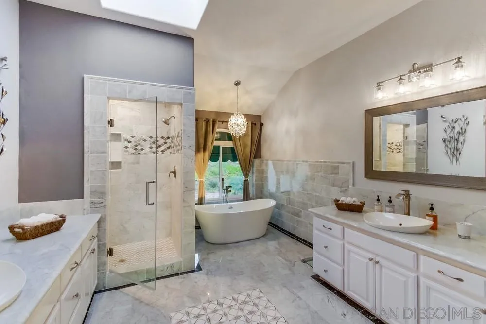 17843 Valle Verde Road Poway, CA 92064 - Photo 43 of 70 a spacious bathroom with a double vanity sink mirror and bathtub